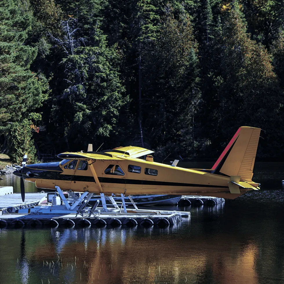 Yellow Aircraft On Water At Pier